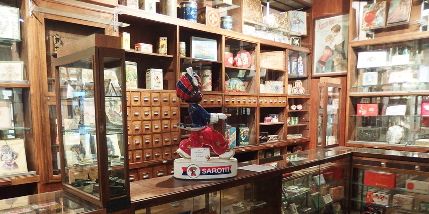 A chocolate museum exhibit showcasing a large chocolate fountain and interactive displays.