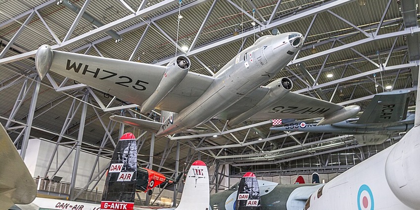 A historic display of artillery and military aircraft at the Imperial War Museum Duxford.