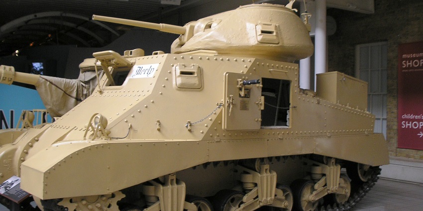 An image of a tan military tank labelled "Murphy," displayed at the Imperial War Museum, London.