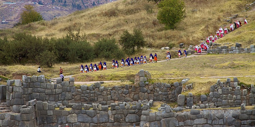 Performers in vibrant costumes celebrate Inti Raymi, the Incan solstice festival