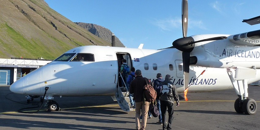 Ísafjörður Airport is nestled between steep mountains with its single runway visible.