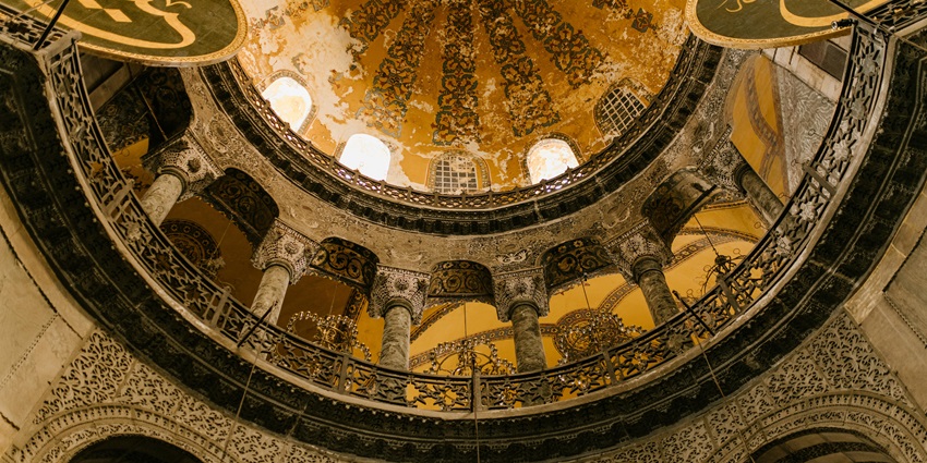 Islamic Center Of Greater Austin featuring domed roof and landscaped entrance with palm trees.