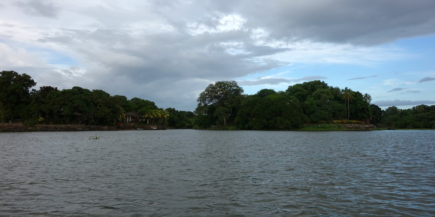 The islets of Granada scattered across the lake, covered in lush greenery and palm trees.
