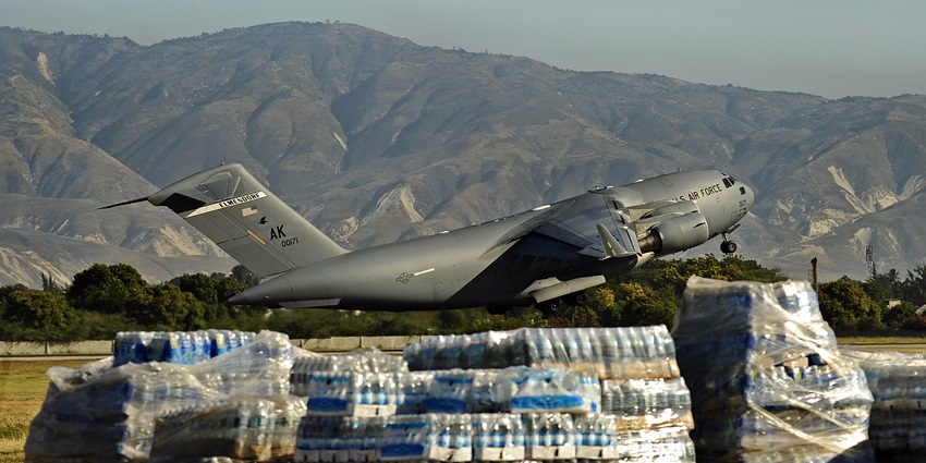 U.S. Air Force C-17 lifts off from the runway at Jacmel, Haiti, after delivering supplies