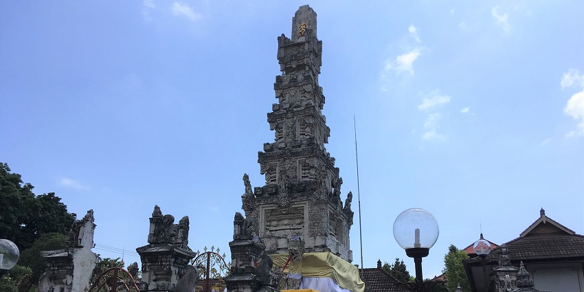 A photo of Jagatnatha Temple in Bali, which features its sacred shrine and delicate stone carvings.