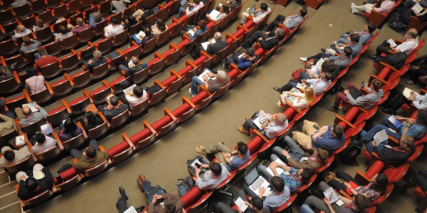 A large space filled with people at an event, one of the best short film festivals in India.