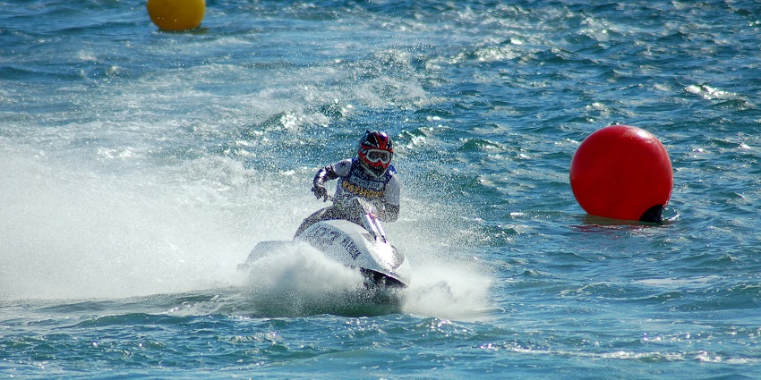 A glimpse of a person enjoying jet skiing on the serene blue waters of Lake Gregory.