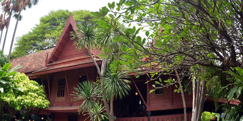 A typical Thai wooden house at Jim Thompson House, set amidst beautiful gardens.