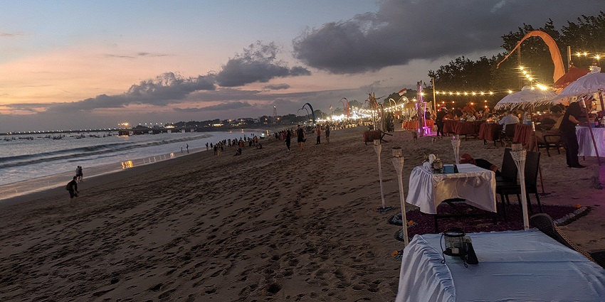 View at Jimbaran Beach as the sky turns shades of purple, one of the beaches near Kuta