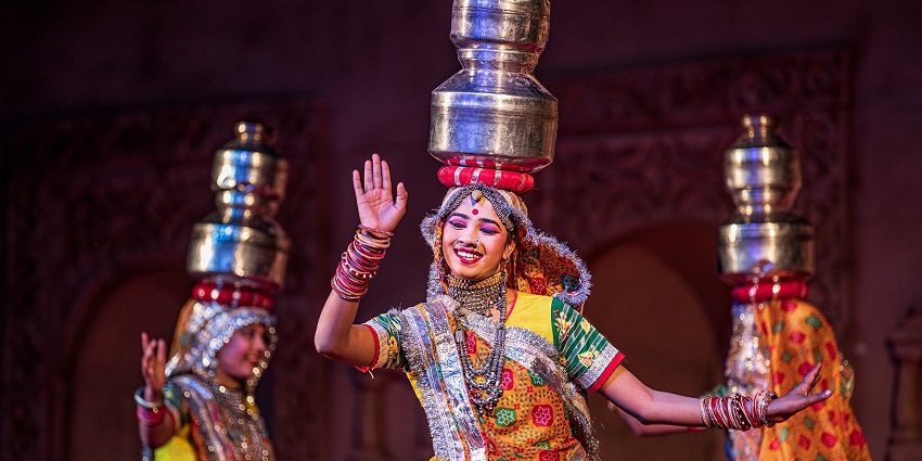 An image of Jodhpur RIFF at Mehrangarh Fort, with traditional folk musicians performing.