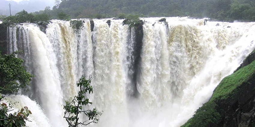 An image showing Jog Falls with water cascading down cliffs in multiple streams.