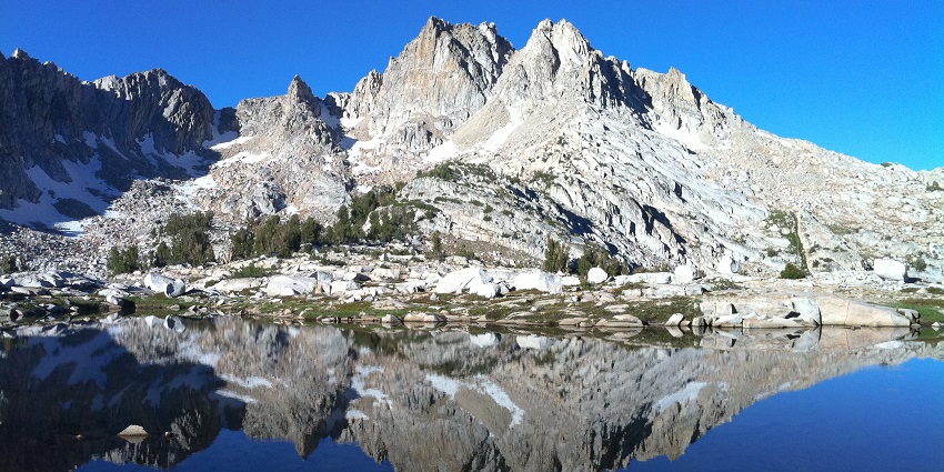 A scenic mountain pass on the John Muir Trail, a perfect place for trekking in July.
