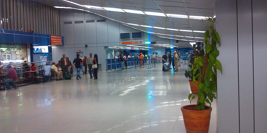 Inside the José Tadeo Monagas International Airport with, people and plants lined up