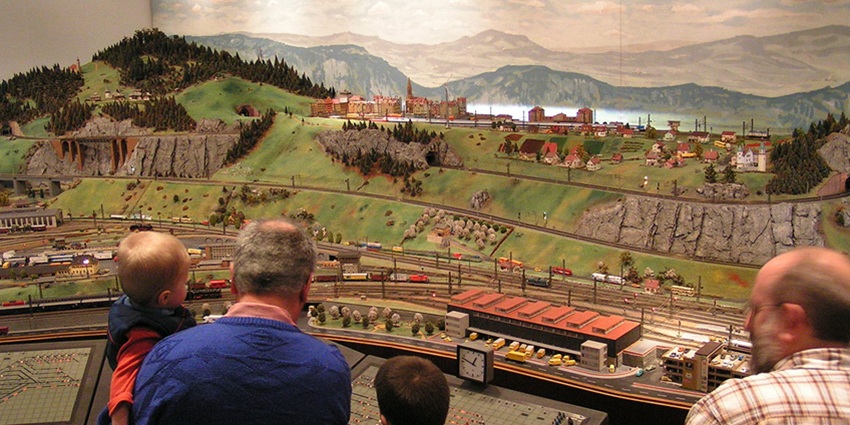 A detailed miniature railway setup at Joshi's Museum, showing small trains running on tracks.