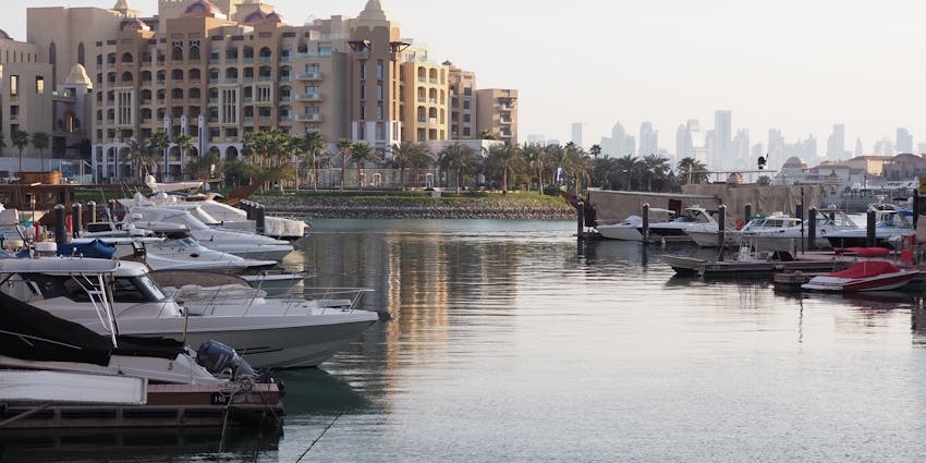 A serene fishing harbor with local seafood markets and docked boats