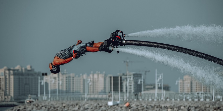 An image of a person Flyboarding in Dubai with a stunning backdrop of Jumeirah Beach
