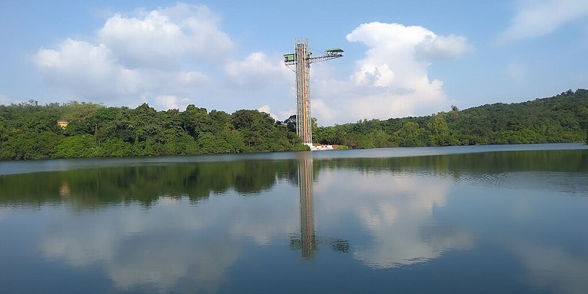 The scenic Mayem Lake in Goa, featuring the Jumpin Heights bungee jumping platform.