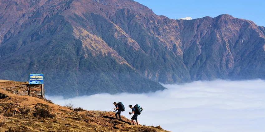 An image of a trekker climbing K2, a top peak for mountain trekking.