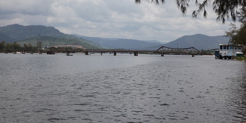 An image of Kampot River, a tourist attraction near Kampot, with the old bridge.