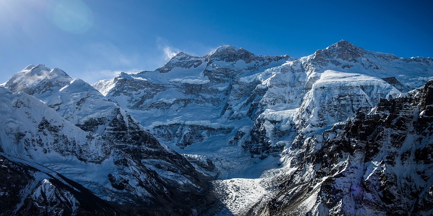 An image of Kanchenjunga, a mountain in the Himalayas with a clear view of its peaks.
