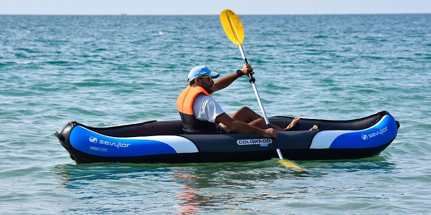 An image showing a person kayaking at the Baga Beach