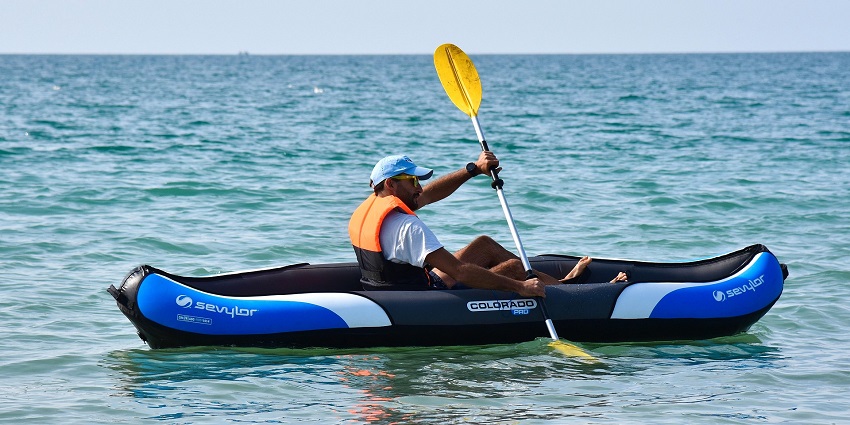 An image showing kayaking through natural surroundings, highlighting unique water sports in Konkan.