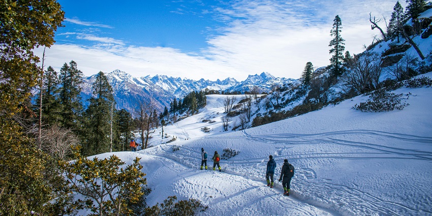 Trekkers in the base camp area of Kedarkantha during December.