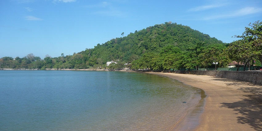 A serene view of Kep featuring shimmering blue waters and pristine golden beaches.