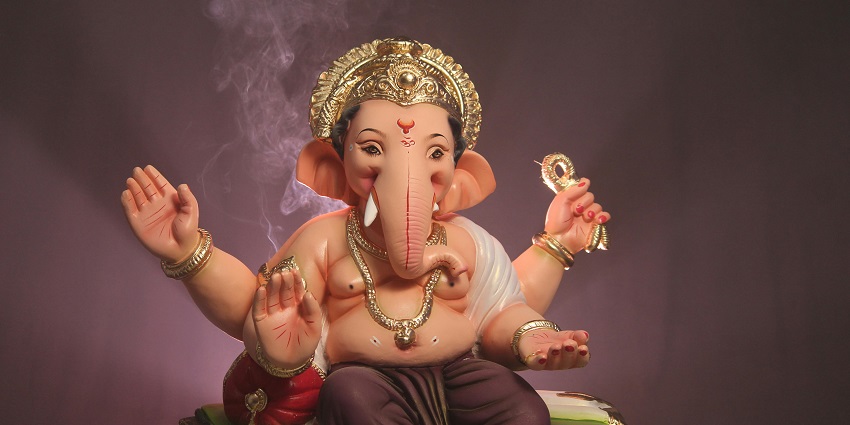 A detailed statue of Lord Ganesha intricately designed with ornate carvings