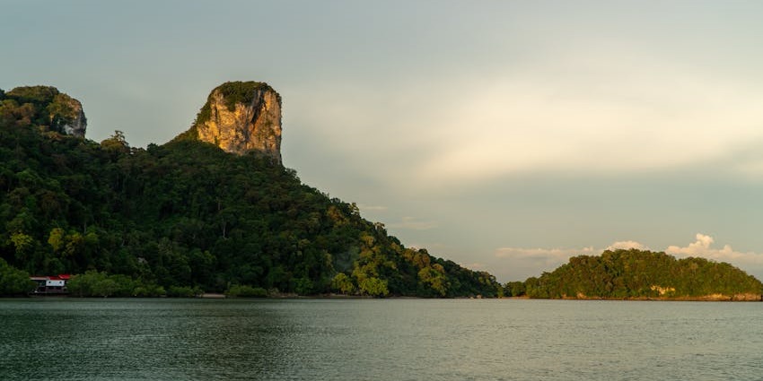 Explore the mystical caves of Khao Khanab Nam, featuring stunning stalactites and rock formations.