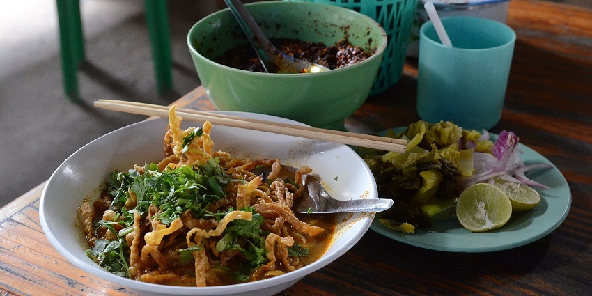A bowl of Chiang Mai’s famous khao soi is a popular dish at the Food Market in Chiang Mai