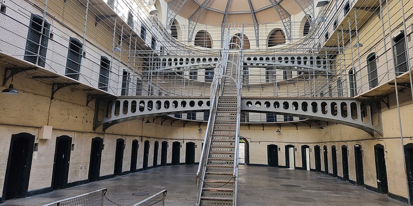 The grand stone hallways of Kilmainham Gaol jail museum in Ireland, where many revolutionaries were imprisoned.