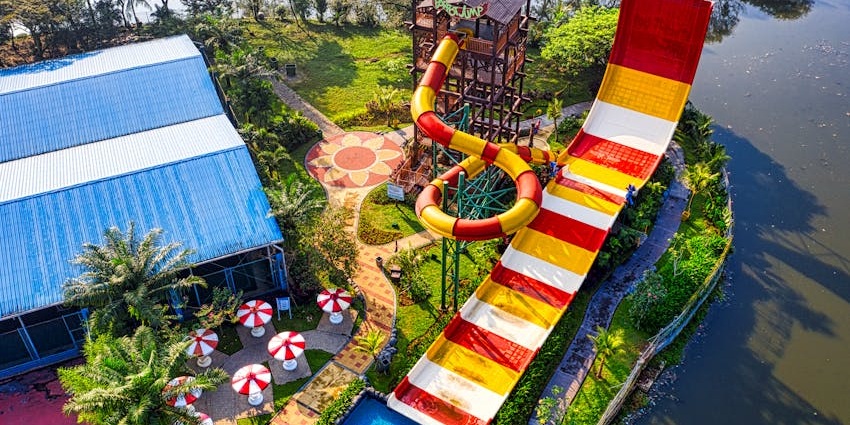 Large white water slides at the Kings Island Water Park, best water park in Ajmer, on a bright sunny day