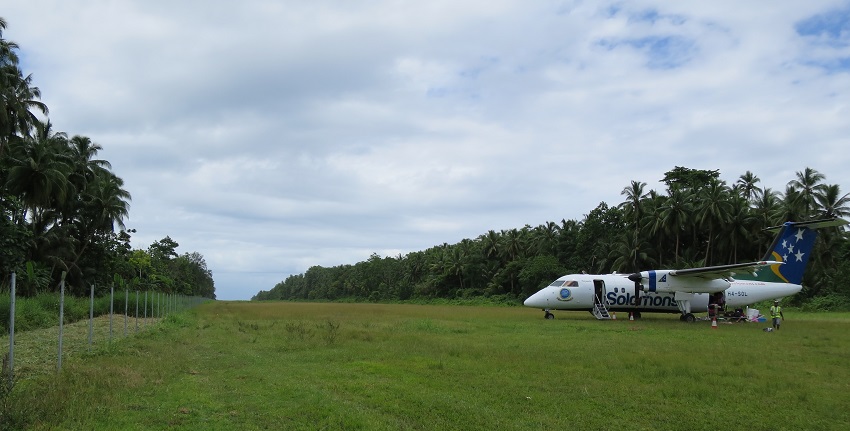 A twin propeller, Solomon Airlines aircraft parked near a grassy runway at Kirakira Airport.
Viewers of this file can see comments and suggestions