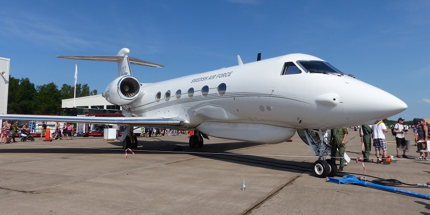 A white aircraft is standing on a tarmac at one of the popular airports in Luxembourg.