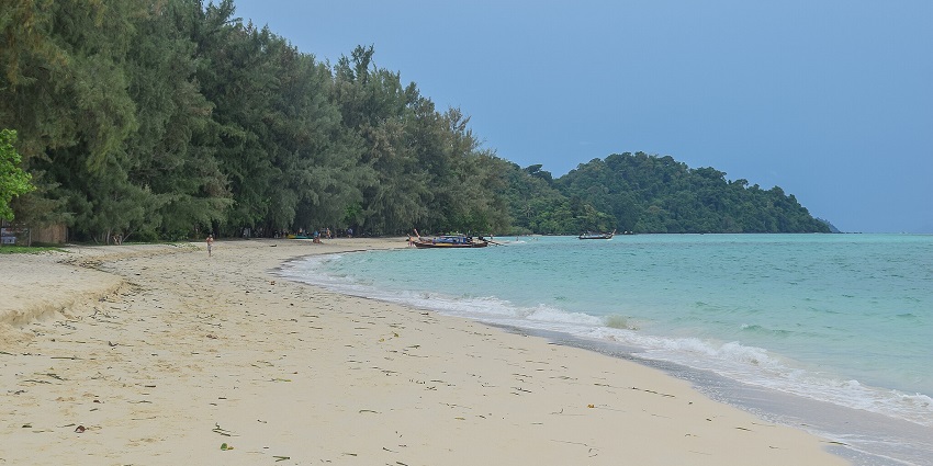 A peaceful island in Thailand, known for its clear waters, coral reefs, and secluded beaches.