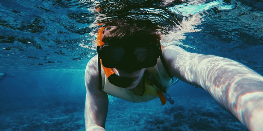 Crescent-shaped island offering calm waters and great spots for snorkelling in Bangkok.