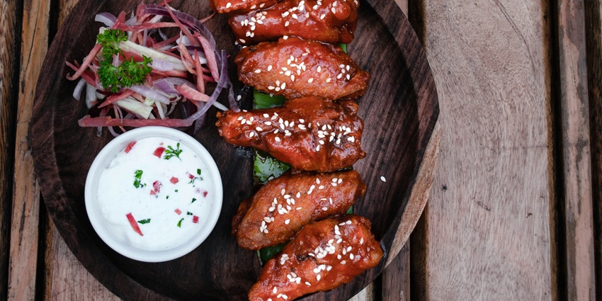 An image showing a close-up shot of delicious Korean food served on a ceramic plate.