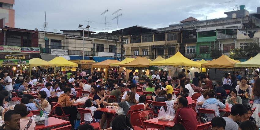 Bustling market featuring local artisans, Thai products, handicrafts, and street food