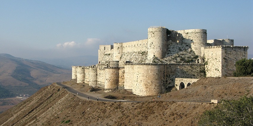 Aerial view of Krak des Chevaliers, showcasing its concentric walls and towers.