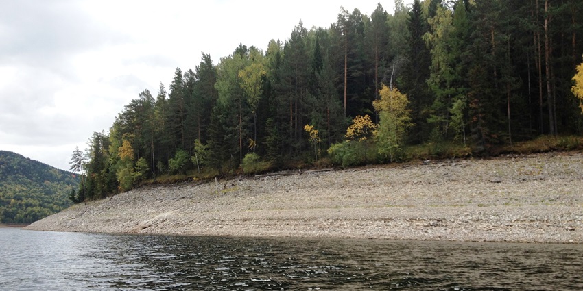 A renunciation scene of the Krasnoyarsk reservoir surrounded by the huge forest of Russia.