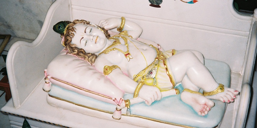An image showing the statue of baby Krishna during Janmashtami celebrations.