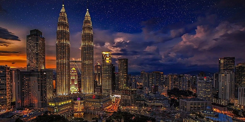 The iconic Petronas Towers in Kuala Lumpur, a modern highlight in places to visit in June in Asia