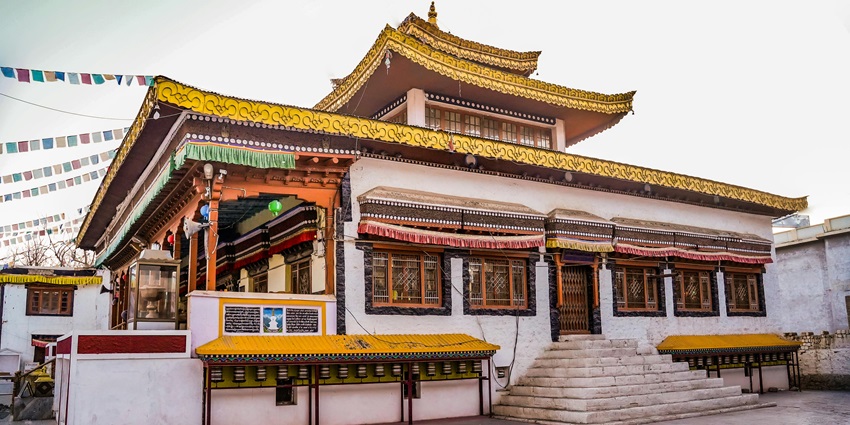 View of Kumbhu Lhakhang, showcasing the intricate architecture in broad daylight.