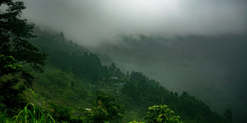 An image showing a panoramic view of Kurseong, with the town and surrounding hills.