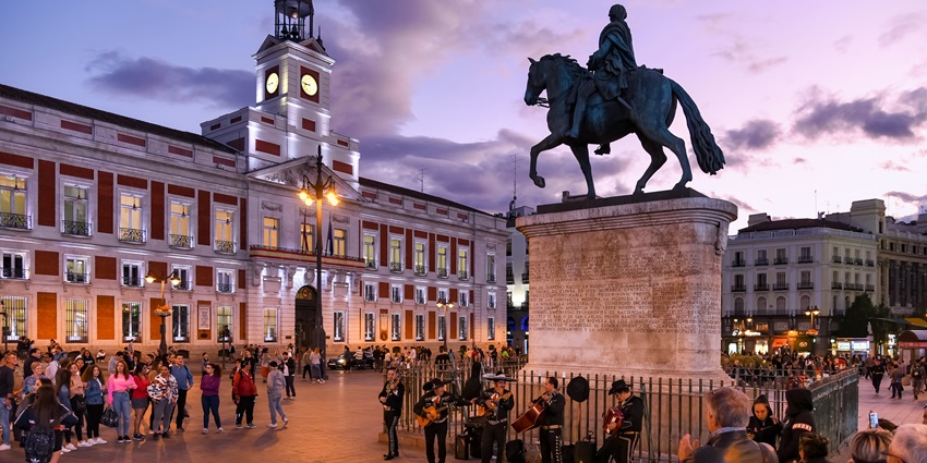 Aesthetic image of a busy Puerta del Sol, one of the best tourist places in Madrid