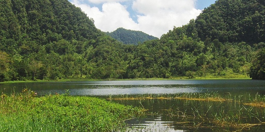 Lac Dzialandzé with a small water body of the lake surrounded by green mountains