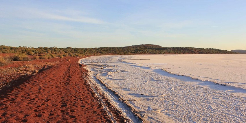 An image of Lake Gairdner, with vast white salt flats and a clear blue sky.