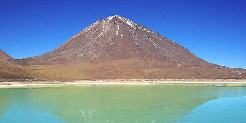 : Licancabur Green Lake with vibrant turquoise waters, one of the highest lakes in the world
