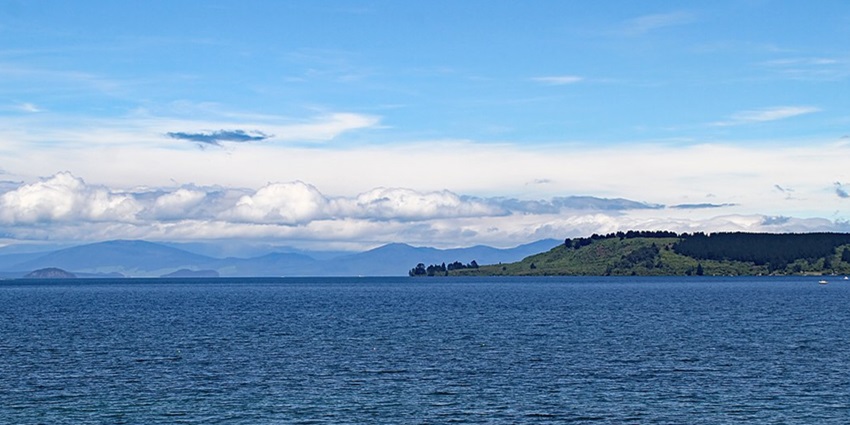 A serene view of Lake Taupo, a large freshwater lake in the heart of New Zealand.